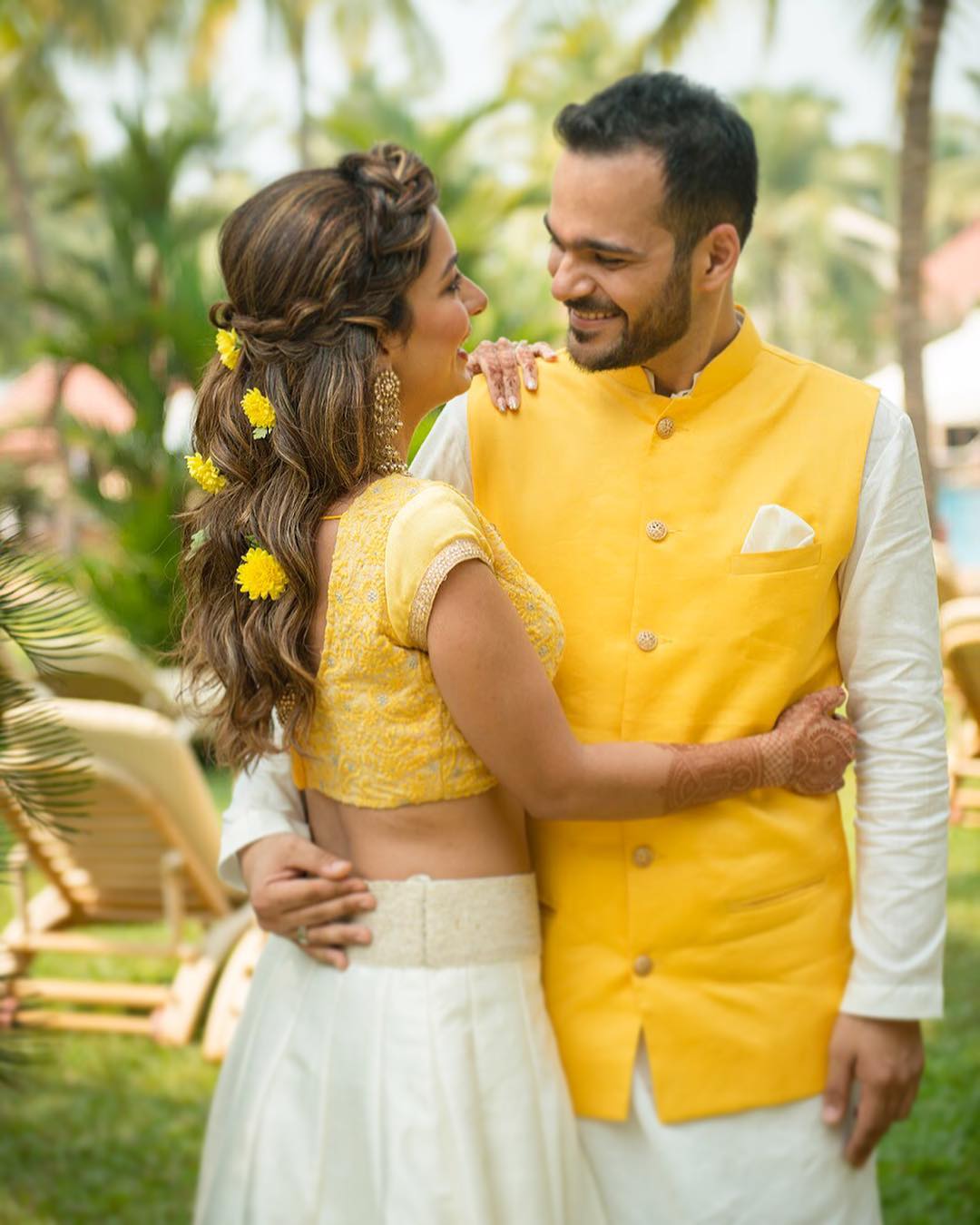 Colour Coordinated Couple Outfit Ideas, bridal outfit ideas, groom outfit ideas, yellow bridal lehenga, sherwani ideas, groom accessories, bridal jewellery, yellow nehru jacket