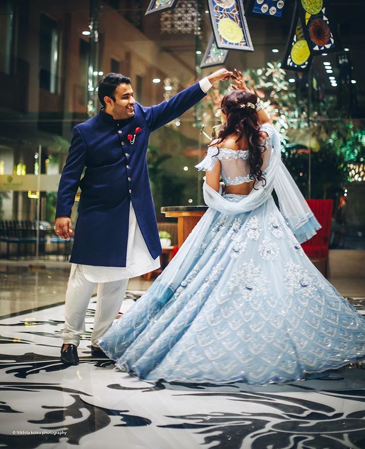 Colour Coordinated Couple Outfit Ideas, bridal outfit ideas, groom outfit ideas, blue bridal lehenga, sherwani ideas, groom accessories, bridal jewellery