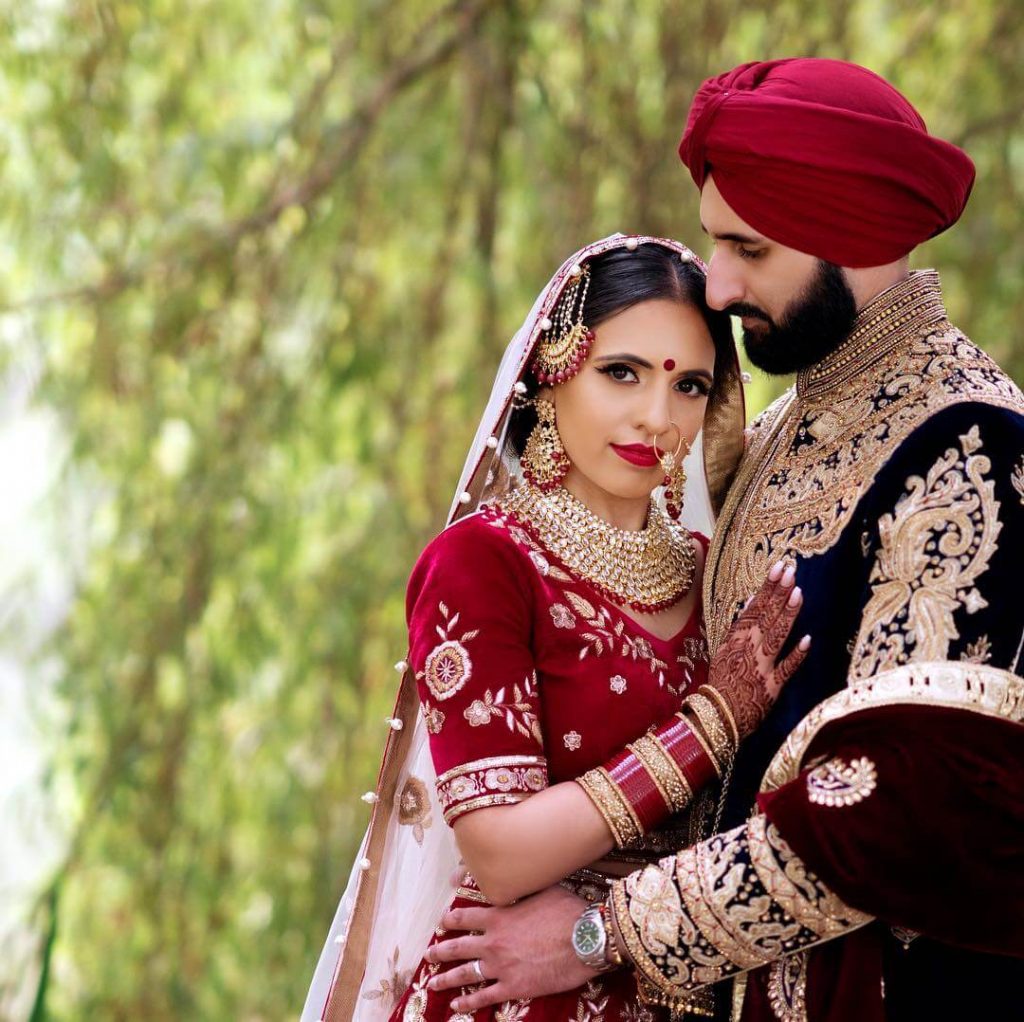 sikh couple,Heavy embroidered outfits