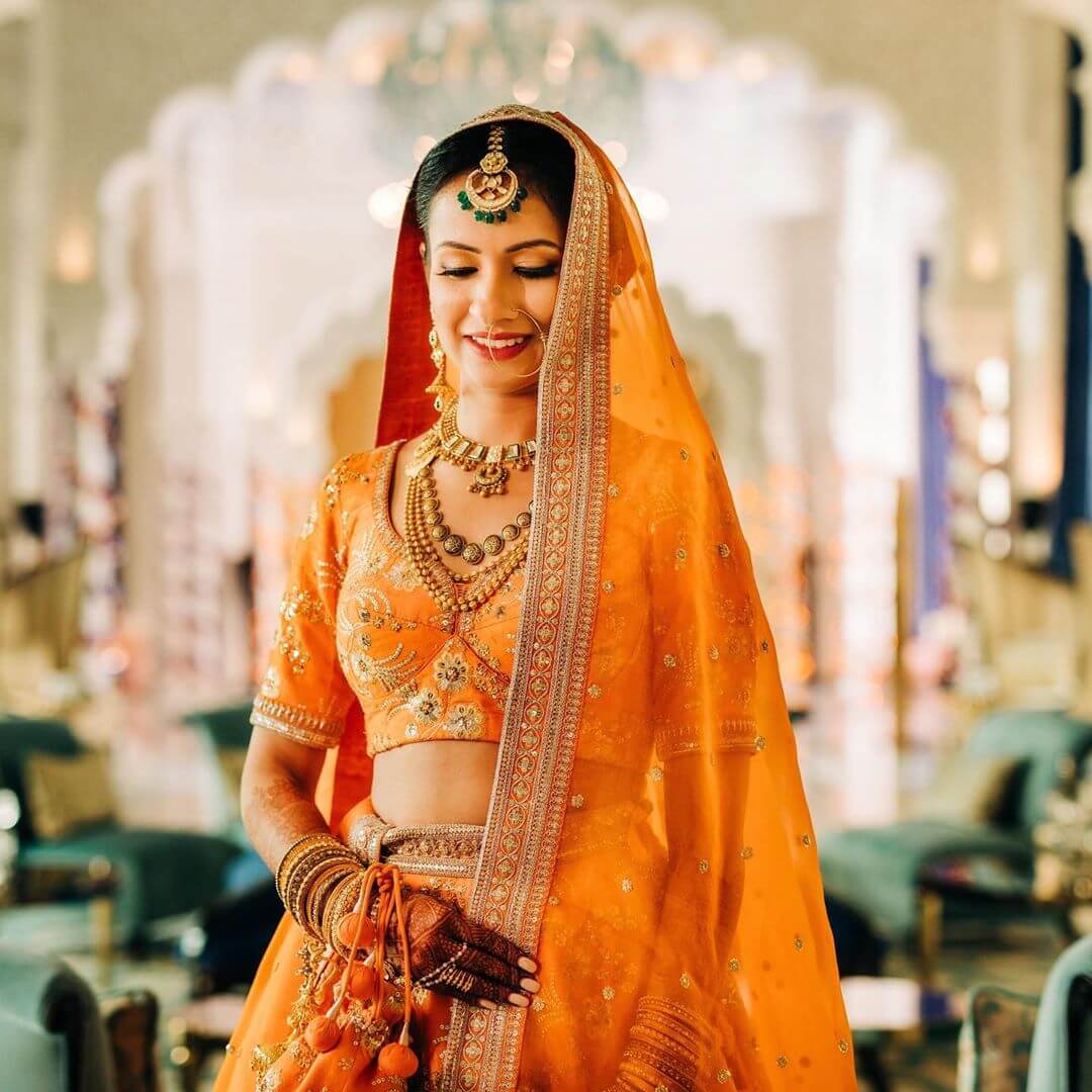 Sabyasachi on sale orange lehenga