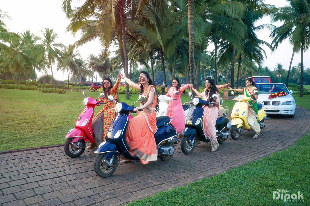 bridal entry with sisters on scooty