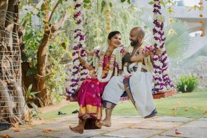 south indian couple's oonjal ceremony