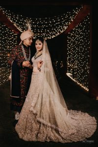 groom in black embroidered sherwani