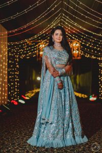 bride in baby blue lehenga