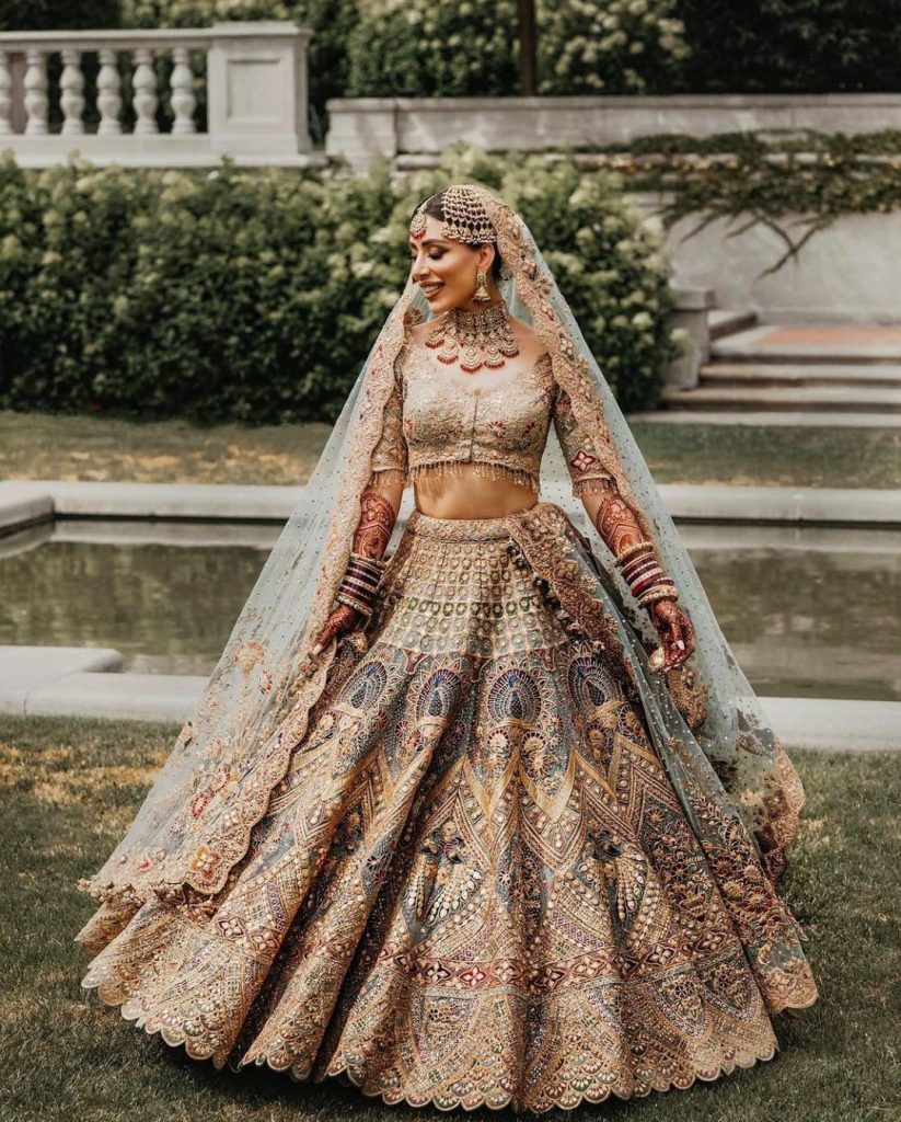 Peacock Design In Multi Thread Wedding Lehenga Choli In Peach