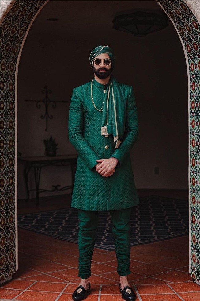 deep green groom outfit