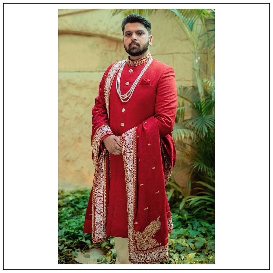 red groom sherwani